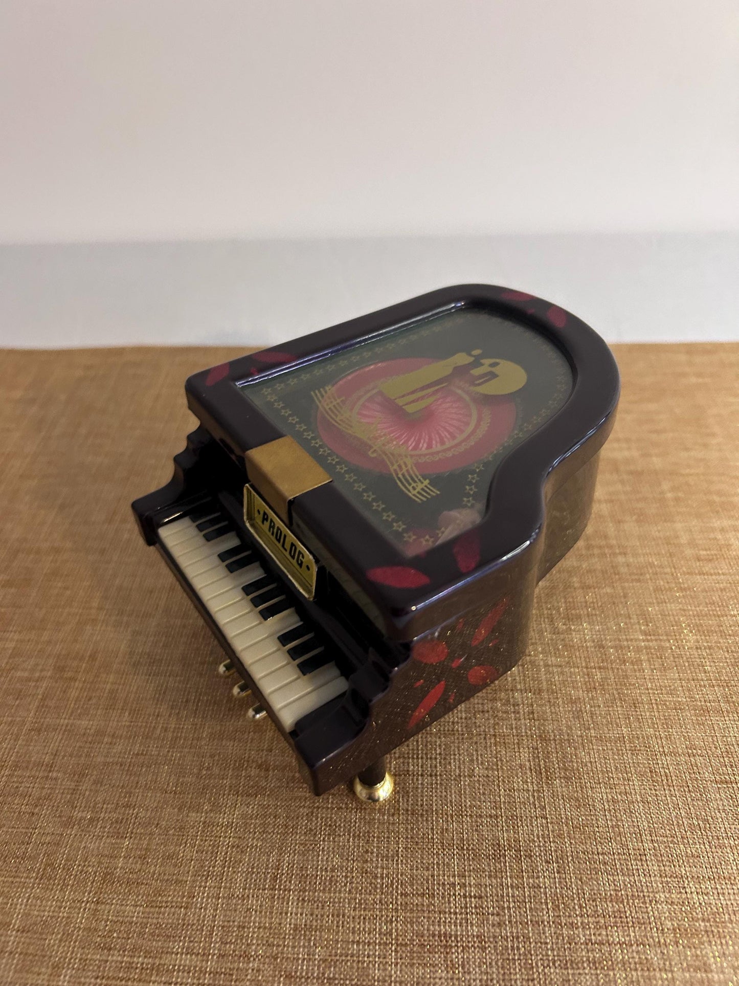 Music box in the shape of a grand piano with dancer