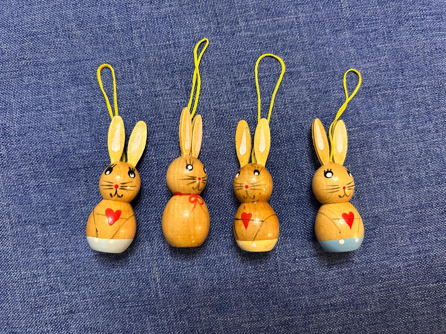 Set of four vintage Easter bunnies in lederhosen for hanging