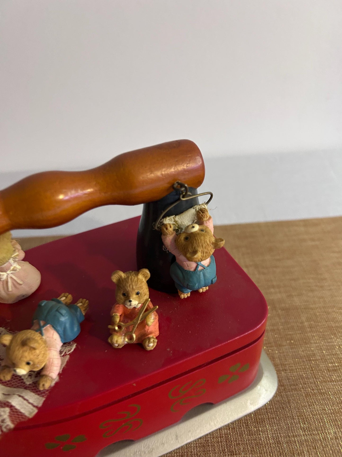 Music box in the shape of an iron with bears