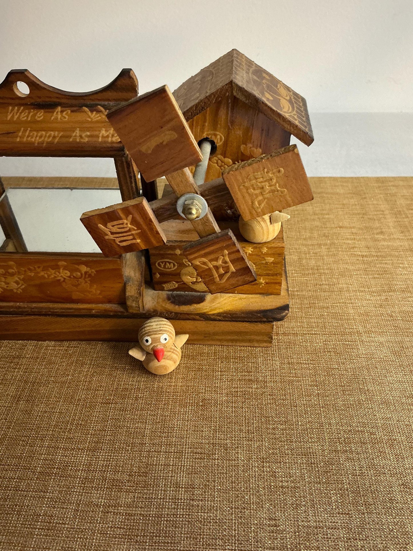 Music box in the shape of a windmill with ducks