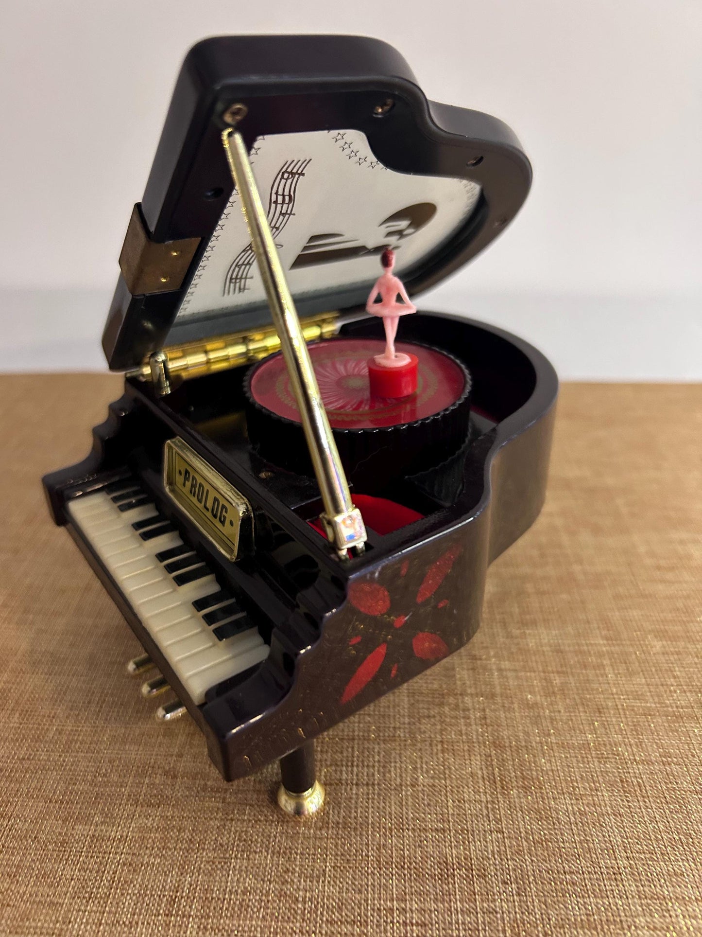 Music box in the shape of a grand piano with dancer